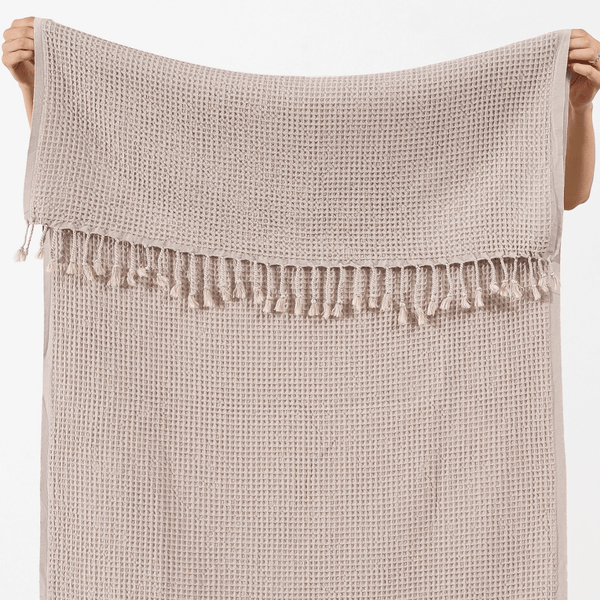 Beige våfflad handduk i närbild